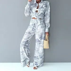 Close-up detail of vintage Toile de Jouy landscape print shirt and wide-leg pants set