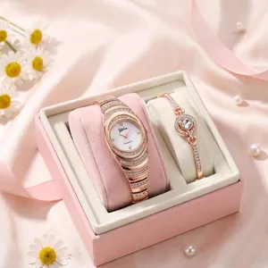 Elegant rose gold quartz watch and rhinestone bracelet gift set for women in a pink box.
