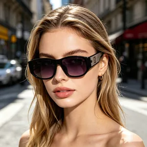 Chic square frame sunglasses with black frames and gradient lenses on a female model