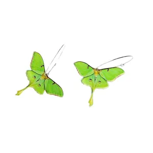 Vibrant green acrylic Luna moth earrings with realistic wing details and silver hooks.