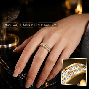 Detailed view of a luxurious gold-plated multi-row crystal ring worn on a woman's hand