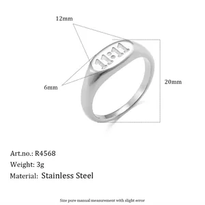 Measurement details of a silver stainless steel ring with 11:11 engraved oval face