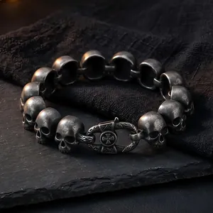 Vintage stainless steel skull link bracelet for men featuring a gothic cross clasp design