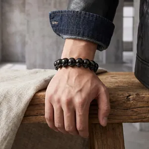 Detailed view of men's black skull head bracelet crafted from titanium steel