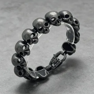 Detailed close-up showing the textured antique finish of a men's titanium steel skull bracelet