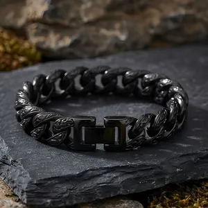 Detail view of 13mm vintage patterned black Cuban link titanium steel bracelet