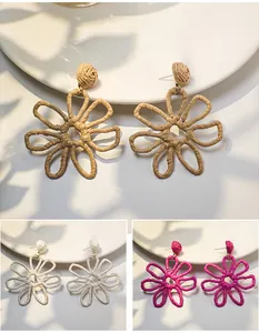 Handmade woven raffia flower earrings in multiple colors for summer vacation style