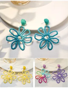 Hand-woven Raffia flower earrings in vibrant colors for a stylish summer vacation look