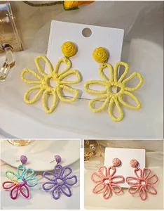 Handmade woven raffia flower earrings in multiple colors for summer vacation style