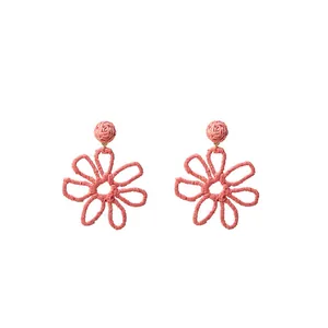 Handmade woven raffia flower drop earrings in coral pink, perfect for summer vacation