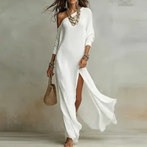 Detail of white one-shoulder maxi dress with high side slit for beach vacation