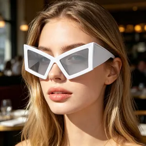 Detailed view of stylish white oversized geometric cat eye sunglasses worn by a female model