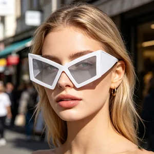 Fashionable white oversized cat-eye sunglasses for women worn by a blonde model