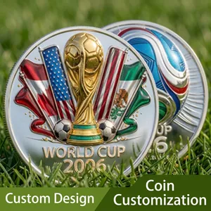 Detailed view of silver 2026 World Cup commemorative coins featuring trophy and flags