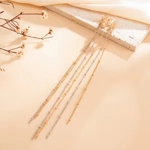 Elegant long tassel chain ear cuffs with mixed gold and silver tones for a chic, modern look.
