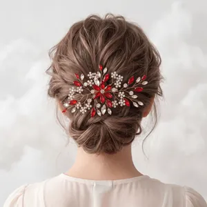 Detailed view of a vintage bridal hair comb with red marquise rhinestones and pearls