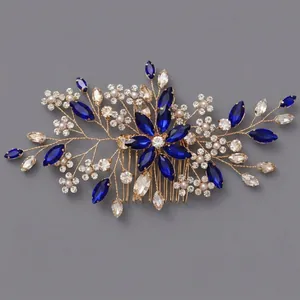 Elegant bridal hair comb with blue marquise crystals and pearls in floral design.