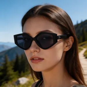 Close-up of stylish black polygon sunglasses worn by a model in a scenic outdoor setting