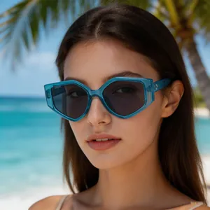 Close-up view of a woman wearing trendy blue polygonal sunglasses on a sunny beach