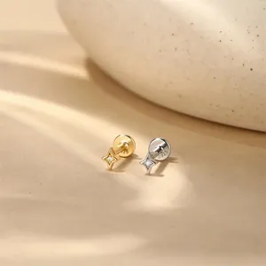 Detailed macro close-up of S925 sterling silver star stud earrings with zircon stones