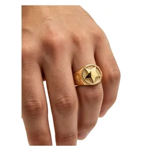 Detailed close-up of a vintage gold-plated five-star signet ring for men on hand