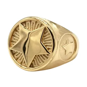 Detailed view of a vintage gold-colored titanium steel signet ring with star motif.
