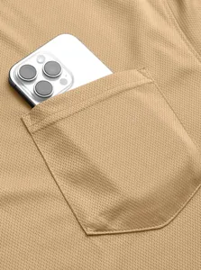 Close-up of tactical polo shirt pocket showing breathable mesh fabric texture