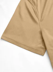 Detailed macro view of breathable mesh fabric on a men's khaki tactical polo shirt