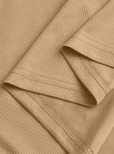 Detailed macro view of khaki breathable mesh polo shirt fabric and durable stitching.