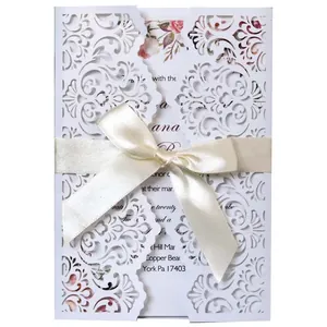 Elegant European laser cut floral lace wedding invitation card with cream ribbon bow