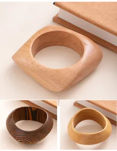 Detailed view of retro square and round wooden bangles featuring unique natural grains.