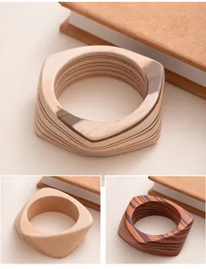 Detailed view of vintage geometric wooden bangles showing natural grain and textures