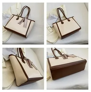 Large capacity faux leather tote bag with brown contrast trim and silk scarf detail