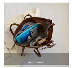 Detailed top view showing the large interior capacity of a chic two-tone tote bag