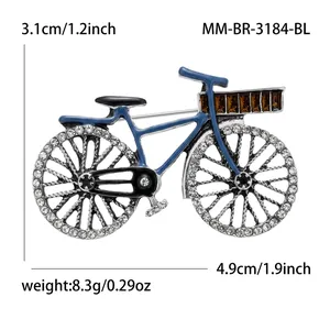 Vintage bicycle brooch pin with blue frame and sparkling rhinestone wheels.