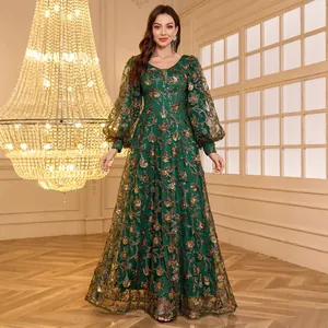 Elegant emerald green V-neck evening gown with gold embroidery, sequins and lantern sleeves