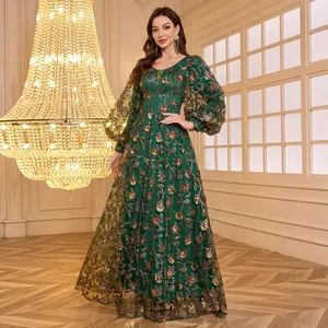 Elegant emerald green evening gown with intricate gold sequin embroidery and lantern sleeves.