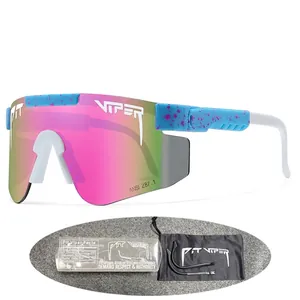 Pit Viper cycling sports sunglasses set with pink-green gradient lenses and blue splatter frame