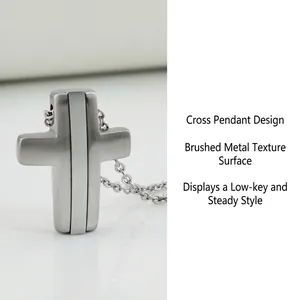 Detailed view of brushed silver cross pendant on a sleek metal chain