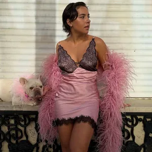 Elegant pink satin slip dress with black lace trim and feather shawl detail