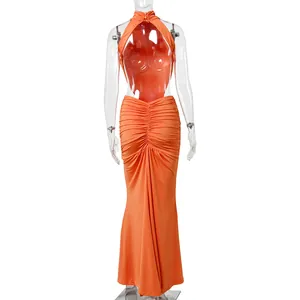 Back view of an elegant orange backless fishtail maxi dress for banquet