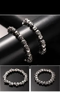Macro detail of retro punk silver skull bead bracelet with metallic vintage finish