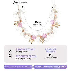 Detailed view of handmade bridal hair band with gold leaves and pearl flowers