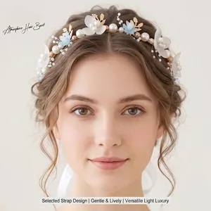 Elegant handmade floral bridal headband featuring golden leaves and white pearls for weddings