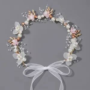 Elegant handmade bridal headband featuring pearls gold leaves and soft pink flowers