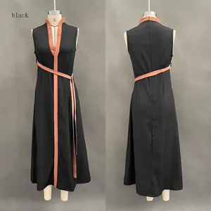 Front and back view of a black sleeveless dress with orange trim on a mannequin.
