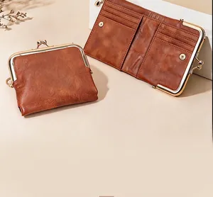 Macro detail of vintage brown clasp wallet showing interior card slots and texture