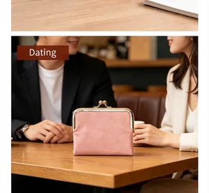 Vintage pink clasp coin purse shown on a cafe table in a lifestyle setting