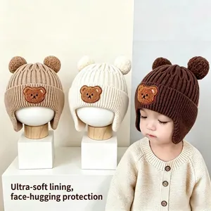 Warm winter knit beanie for babies with cute bear ears and embroidery patch design
