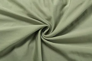 Vista macro dettagliata della trama del tessuto a coste verde oliva per un mini abito